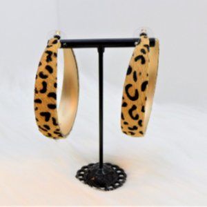 Leopard and gold statement hoop earrings.
